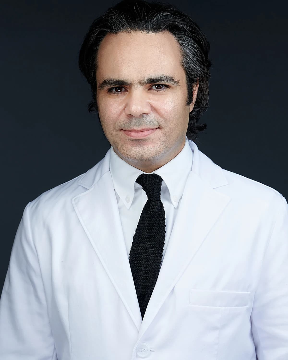 Dr. Iham Gammas, DMD, DABOI — Board Certified Dental Implant Specialist at Lowell Family Dental Practice & Implant Center